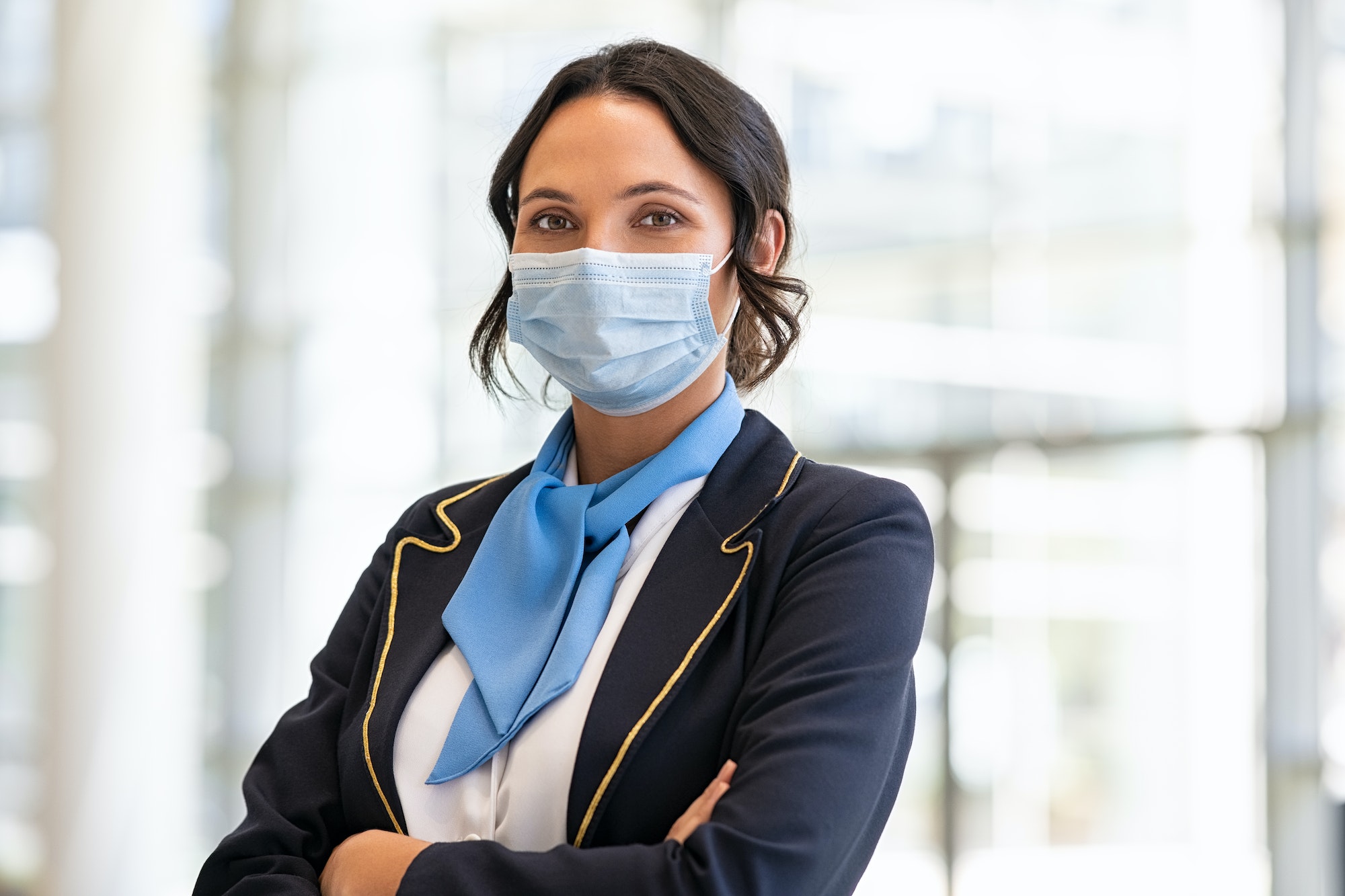 Air hostess wearing face mask during virus pandemic